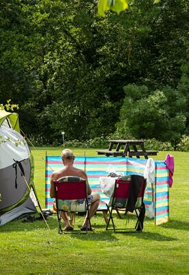 Relaxing grass camping field at Rockbridge Park, Wales