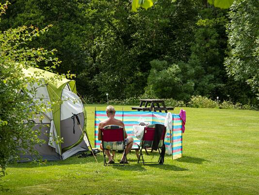 Relaxing grass camping field at Rockbridge Park, Wales